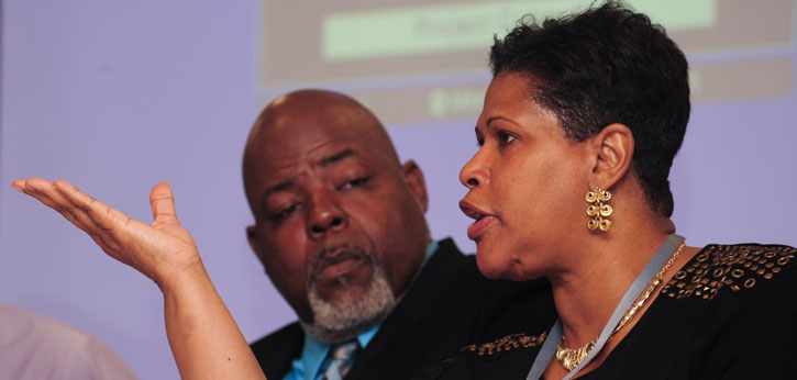 Jitu Brown (left) listens as Ocynthia Williams (right) discusses family engagement policy and practice.