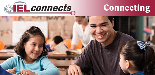 @IELconnects - Connecting: Two elementary community school students work with a community mentor in the classroom.