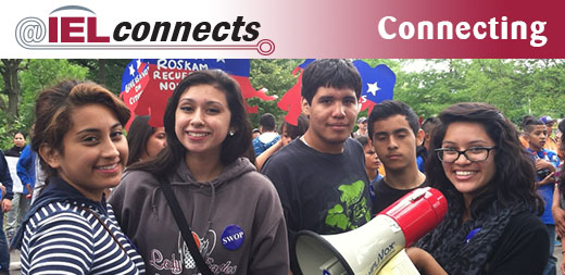 @IELconnects - Connecting: A group of community school students organize outdoors.