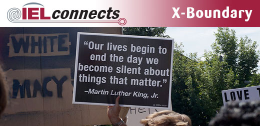 A protestor in Charlottesville holds up a sign with a Martin Luther King Quote: "Our lives begin to end the day we become silent about things that matter."
