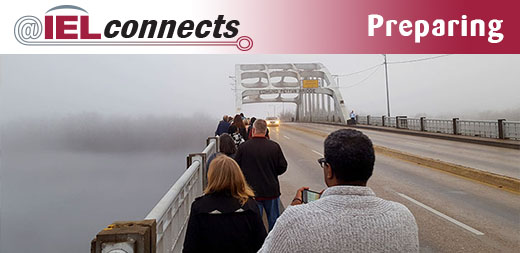 @IELconnects - Preparing: Participants in the IEL Civil Rights Bus Tour walk across Edmund Pettus Bridge in Selma, Alabama in the fog.