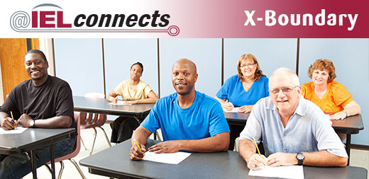 @IELconnects - Xboundary: A diverse group of adults study in a classroom.