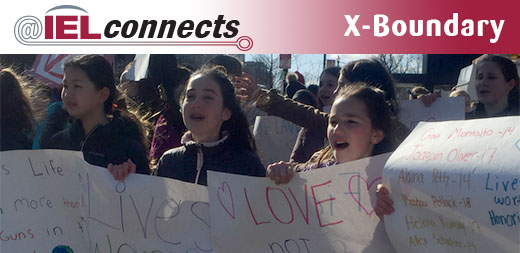 @IELconnects - X-Boundary: A group of young protesters with signs
