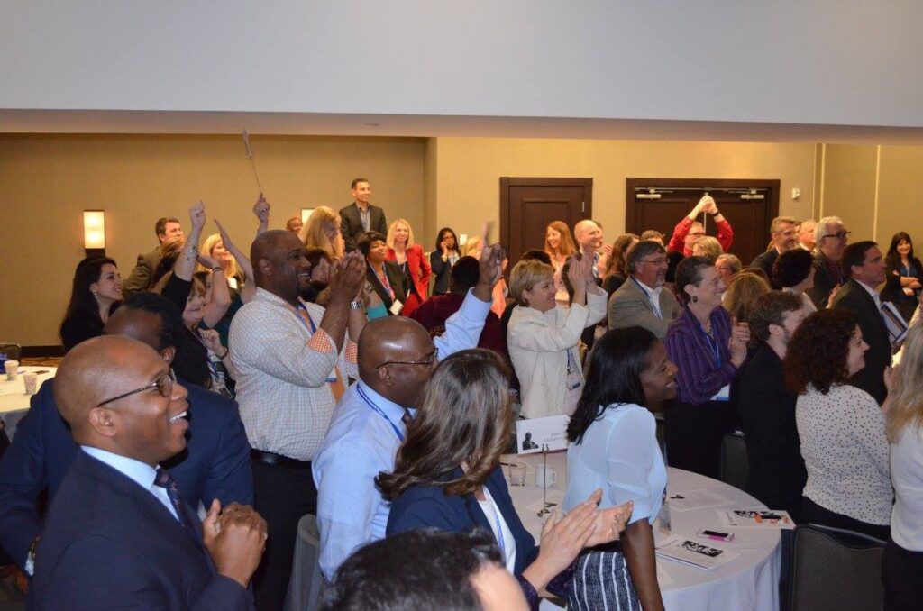 Group of attendees cheering